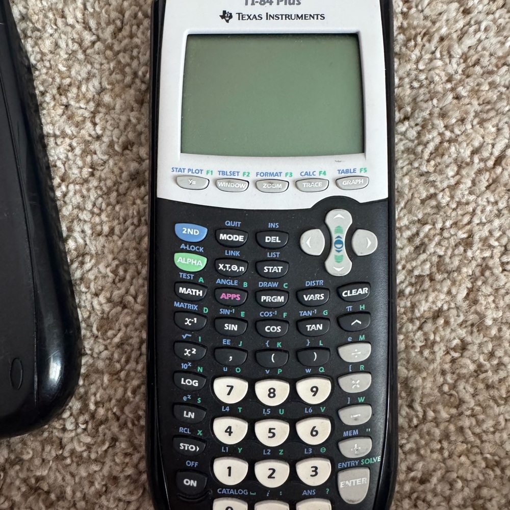 Texas Instruments TI-84 Plus Graphing Calculator in Black and White